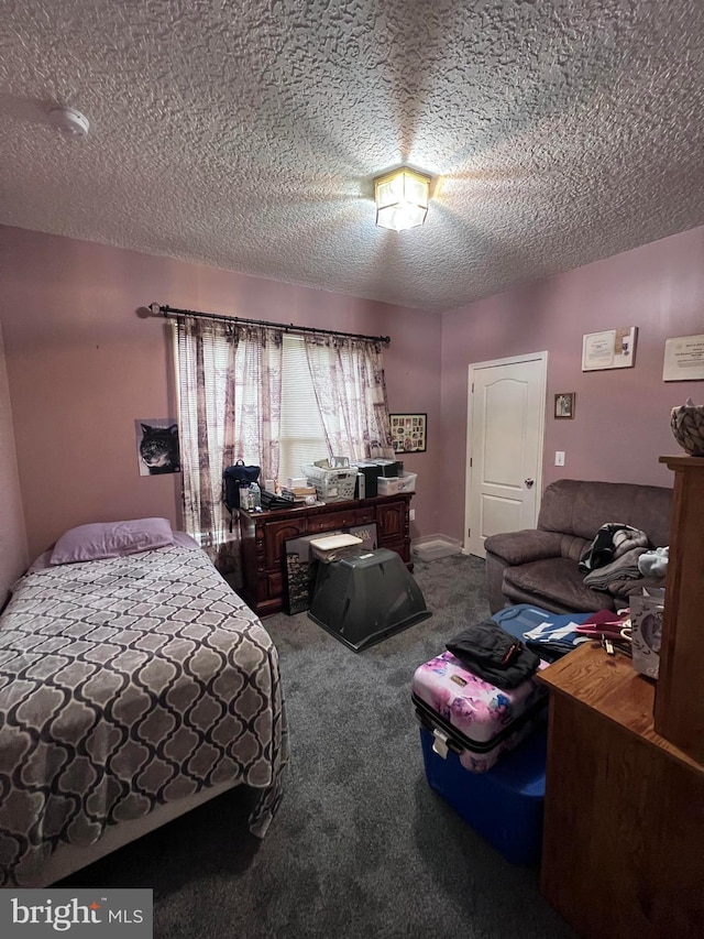 carpeted bedroom with a textured ceiling