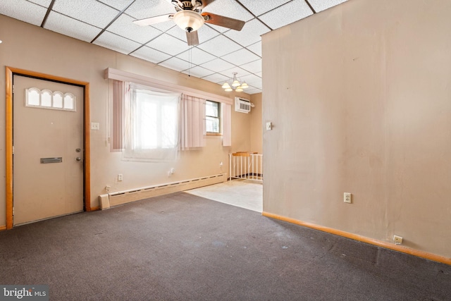 interior space featuring a baseboard radiator, light carpet, a wall mounted air conditioner, and a drop ceiling