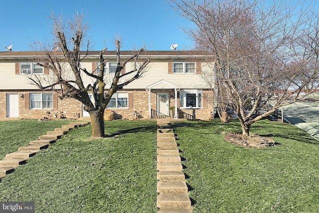 view of front facade with a front yard