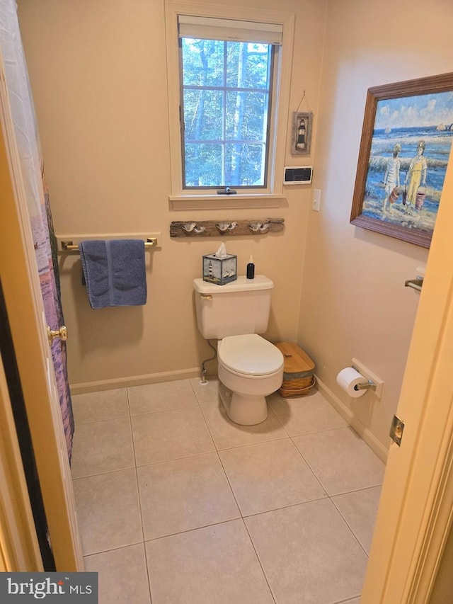 bathroom featuring tile patterned floors and toilet