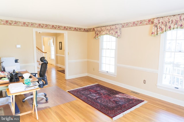 office area featuring hardwood / wood-style flooring and ornamental molding