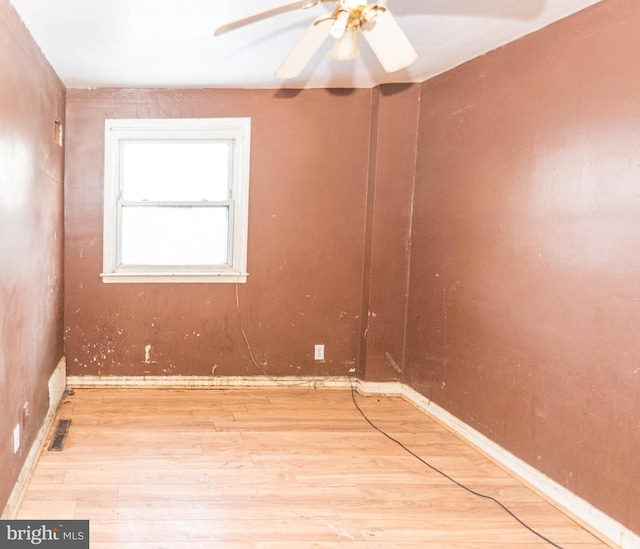 unfurnished room featuring ceiling fan and light hardwood / wood-style floors