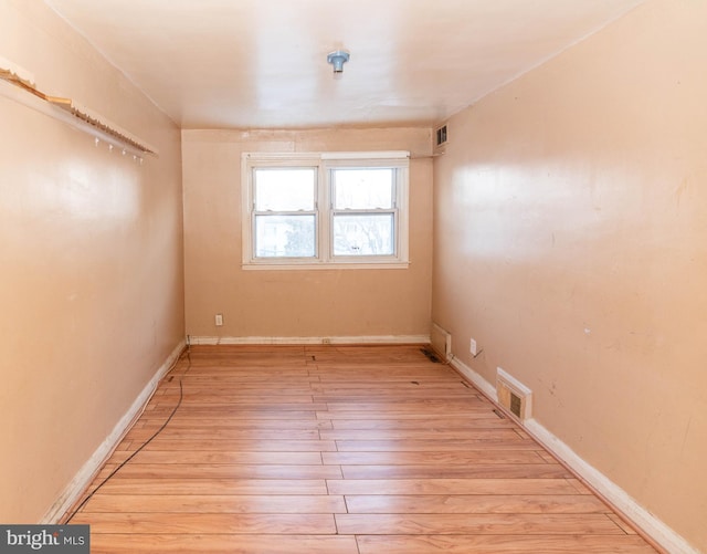 unfurnished room featuring light hardwood / wood-style flooring