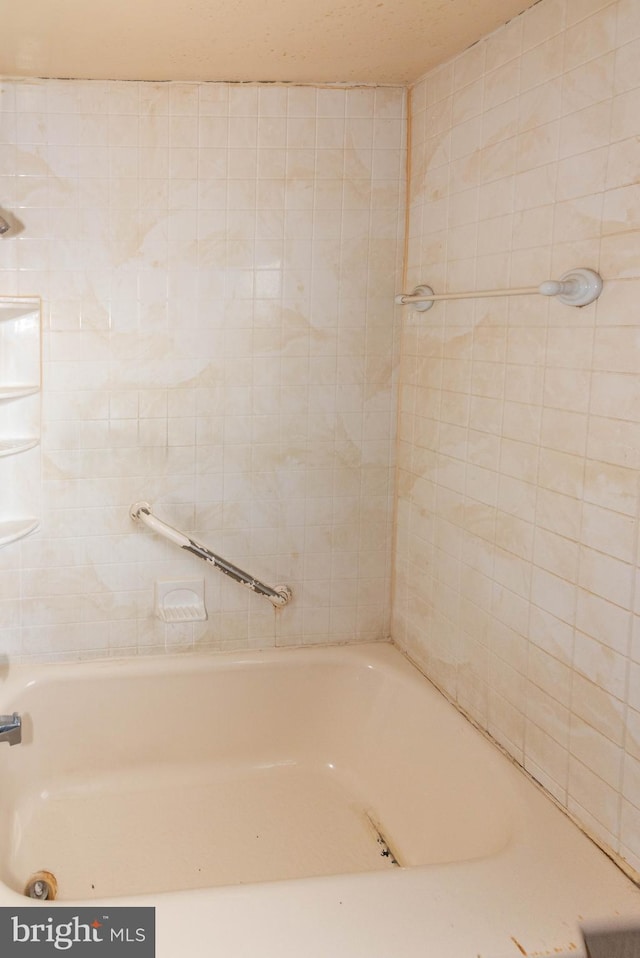 bathroom featuring a tub