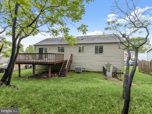 rear view of house featuring a deck and central air condition unit
