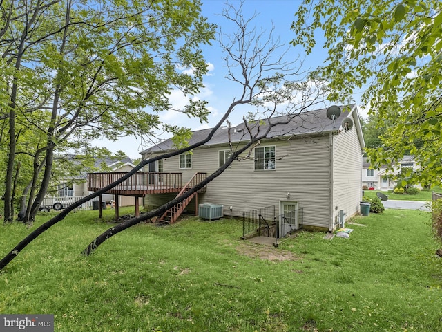 back of house featuring a deck, a yard, stairway, and central AC unit