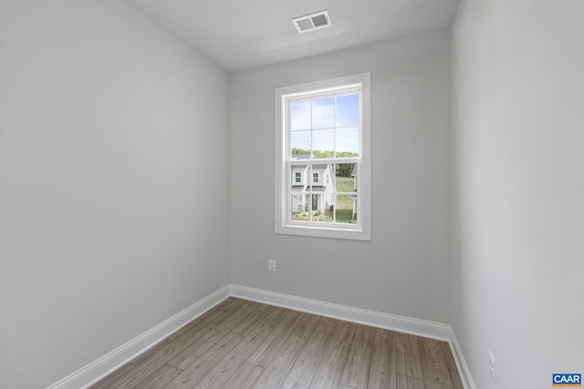 unfurnished room featuring light wood-type flooring