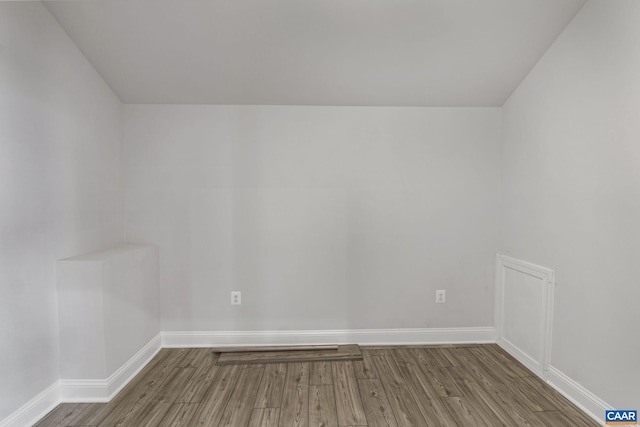 unfurnished room with hardwood / wood-style floors