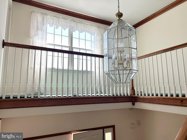 details with crown molding and a chandelier