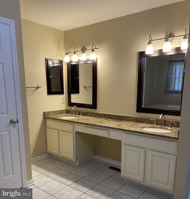 bathroom with vanity and tile patterned flooring