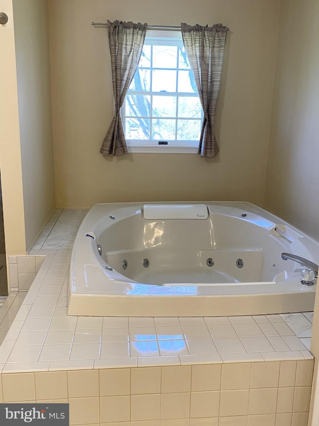 bathroom featuring tiled bath