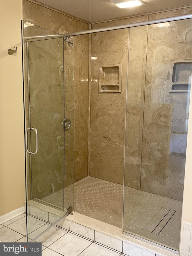 bathroom featuring tile patterned flooring and walk in shower