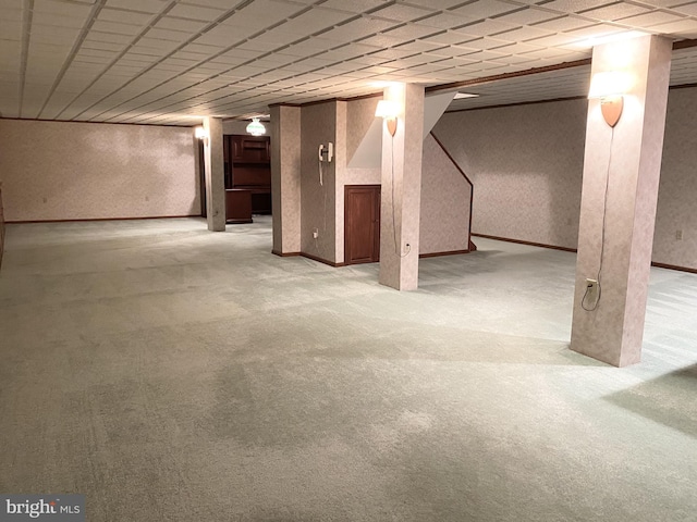 basement featuring light colored carpet