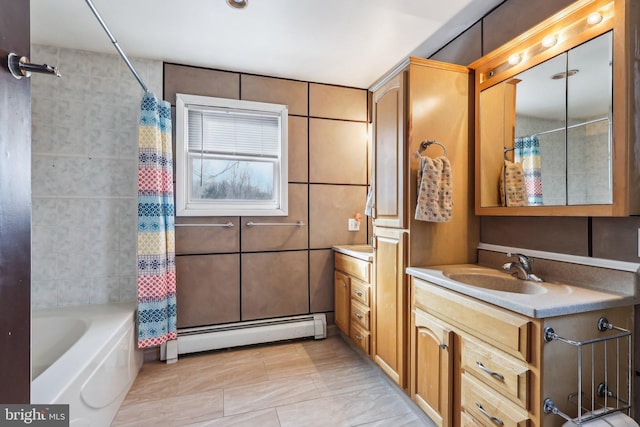 bathroom featuring vanity, a baseboard heating unit, tile patterned flooring, and shower / bath combo