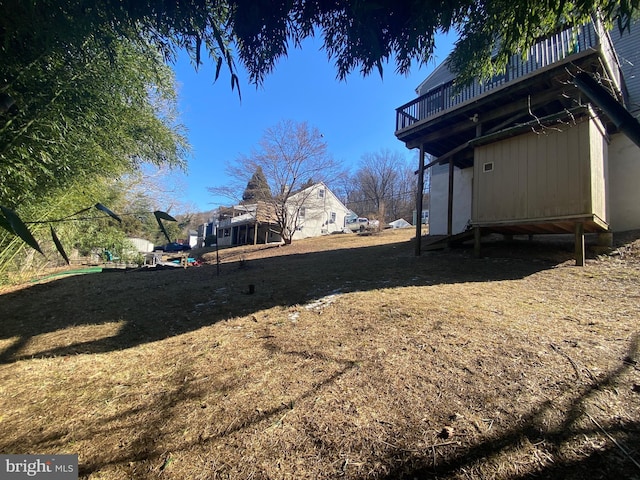 view of yard with a wooden deck