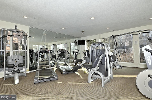 workout area featuring a textured ceiling