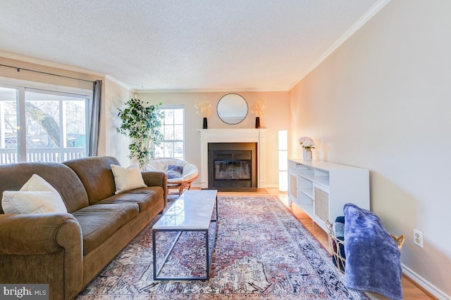 living room featuring crown molding, a healthy amount of sunlight, and hardwood / wood-style floors