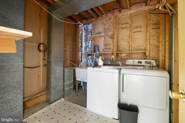 laundry room featuring separate washer and dryer and sink