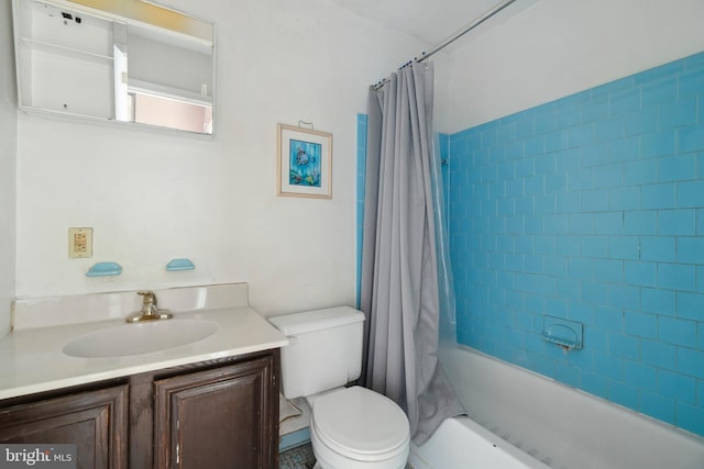 full bathroom with vanity, toilet, and shower / bath combo with shower curtain