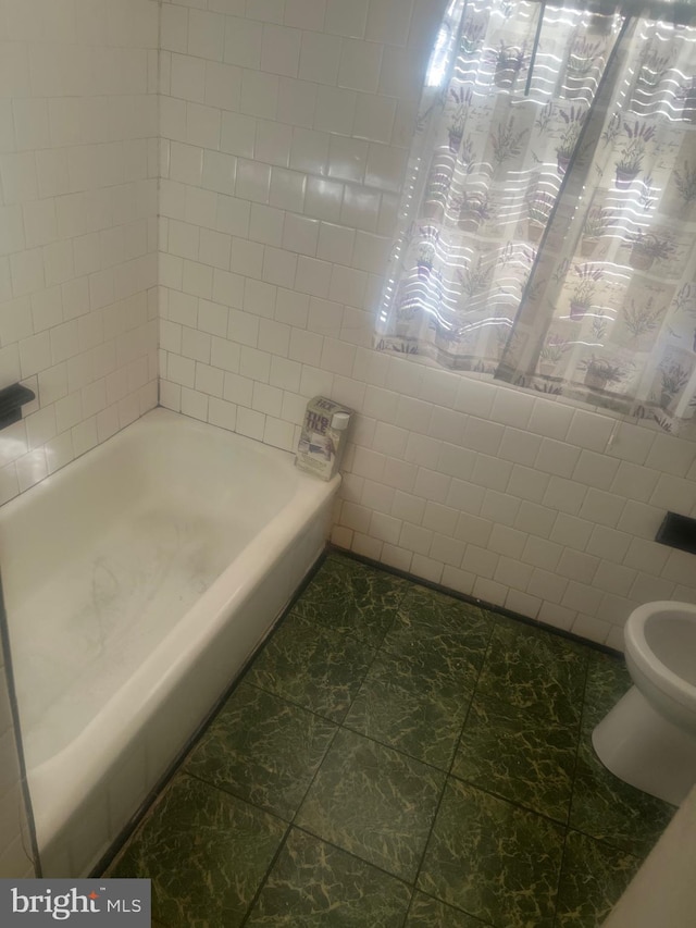 bathroom featuring shower / tub combination, toilet, and tile patterned flooring