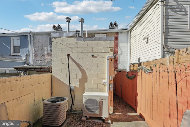 view of home's exterior featuring cooling unit and ac unit