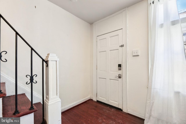 entrance foyer featuring dark hardwood / wood-style floors