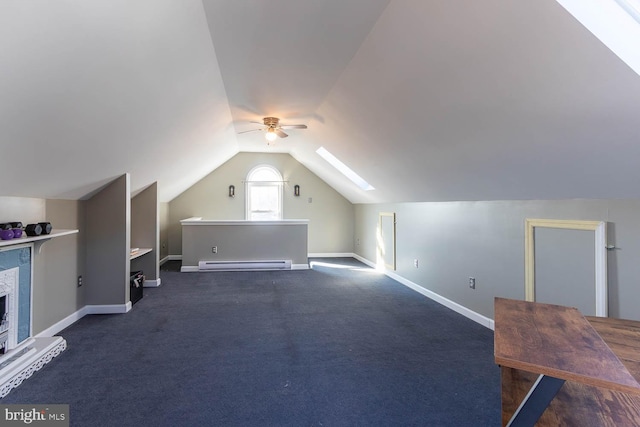 bonus room featuring vaulted ceiling, a baseboard heating unit, ceiling fan, and dark carpet