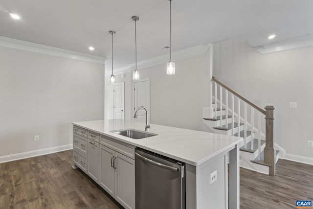 kitchen featuring sink, an island with sink, dark hardwood / wood-style flooring, decorative light fixtures, and stainless steel dishwasher