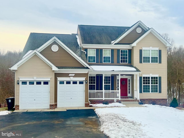 view of front of home featuring a garage and covered porch