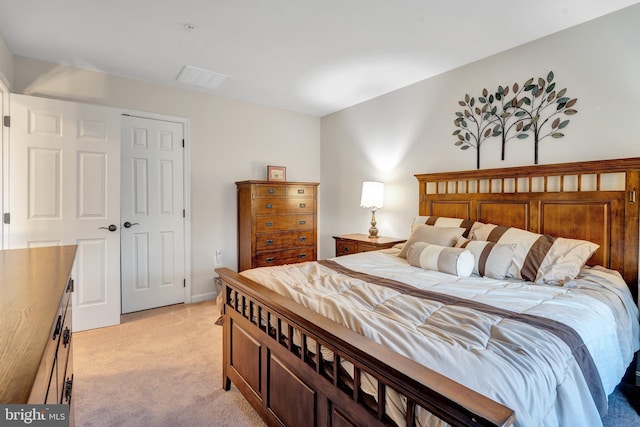 carpeted bedroom with a closet