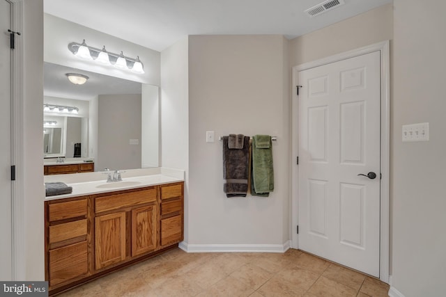 bathroom featuring tile patterned floors and vanity