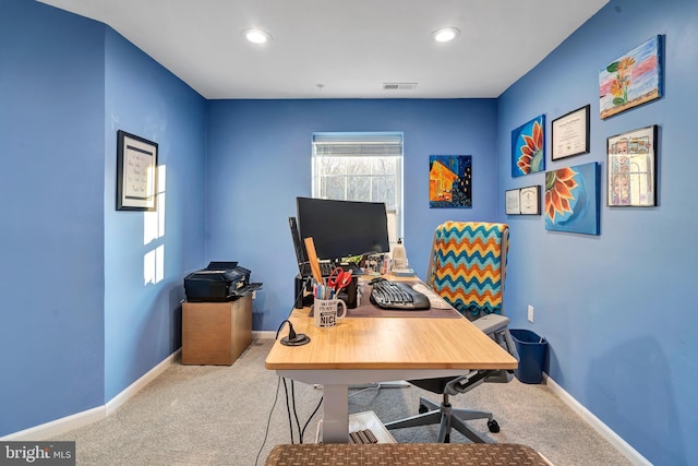 office space with light colored carpet