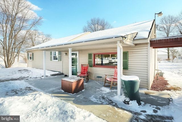 view of snow covered house