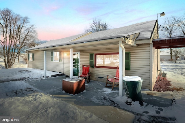 view of snow covered house