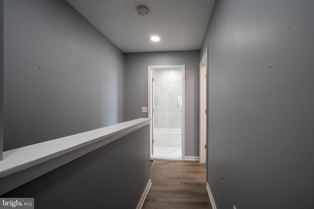 hallway featuring dark hardwood / wood-style flooring