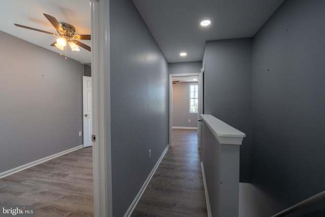 hallway with hardwood / wood-style floors