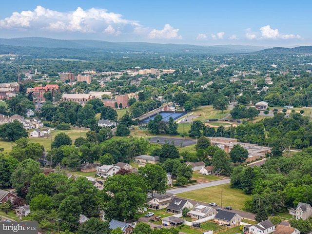 birds eye view of property with a mountain view