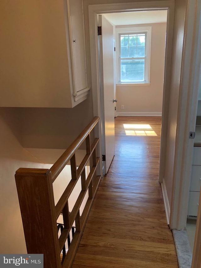 corridor featuring light hardwood / wood-style floors