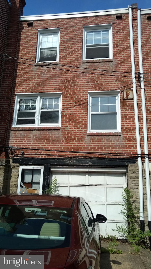 view of side of property with a garage