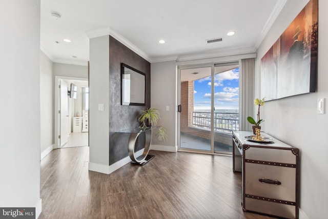 interior space featuring crown molding and hardwood / wood-style floors