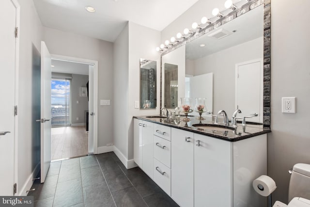 bathroom featuring vanity and tile patterned flooring