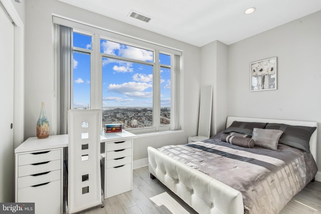 bedroom featuring light wood-type flooring