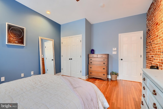 bedroom featuring light hardwood / wood-style floors and a closet