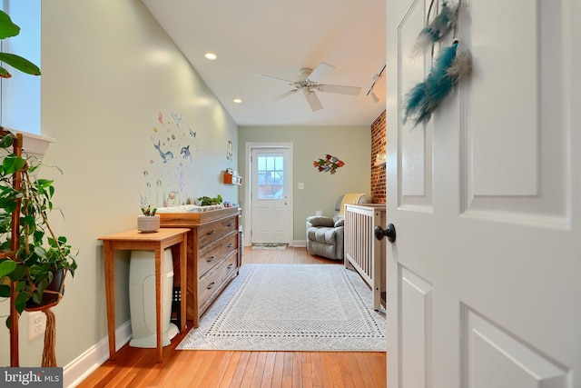 bathroom with wood-type flooring and ceiling fan