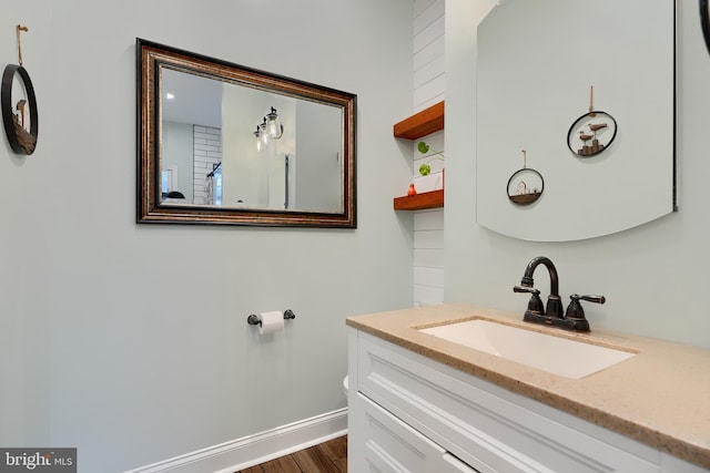 bathroom featuring hardwood / wood-style flooring and vanity