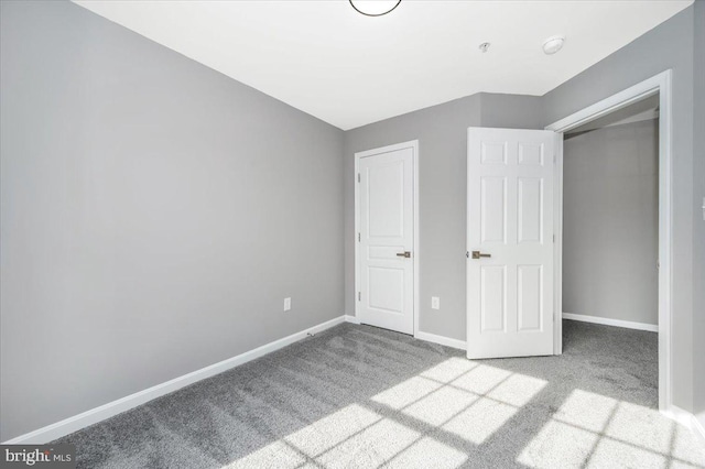 unfurnished bedroom with light carpet