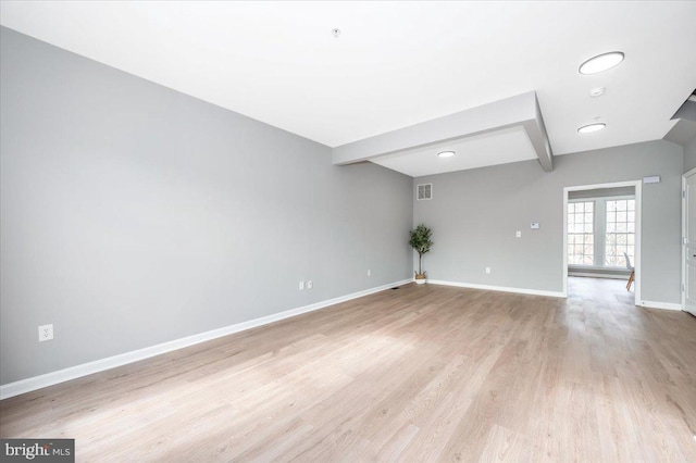 spare room with light hardwood / wood-style floors