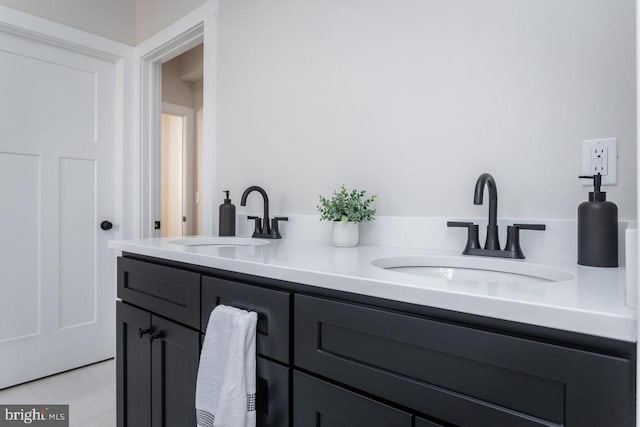 bathroom with vanity and tile patterned flooring