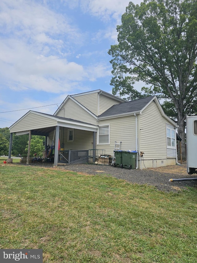 rear view of property with a lawn