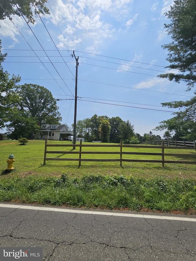 view of yard with a rural view